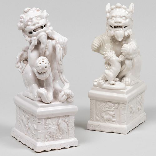 Two Chinese White Glazed Porcelain Buddihstic Lions