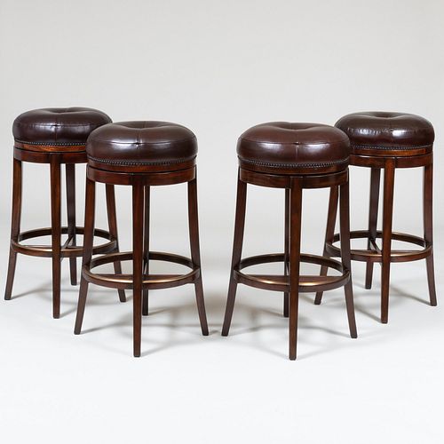 Four Theodore Alexander Stained Wood Leather Upholstered Swivel Bar Stools