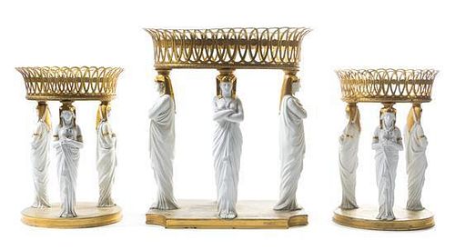 A French Gilt Bronze and Parian Table Garniture Height of tallest 16 x width 14 inches.