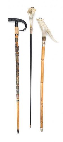 Three Sword Canes Length of longest 36 1/4 inches.
