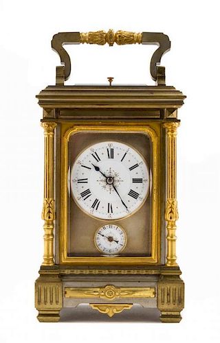 * A French Parcel Gilt Bronze Repeating Carriage Clock Height 8 1/4 inches.