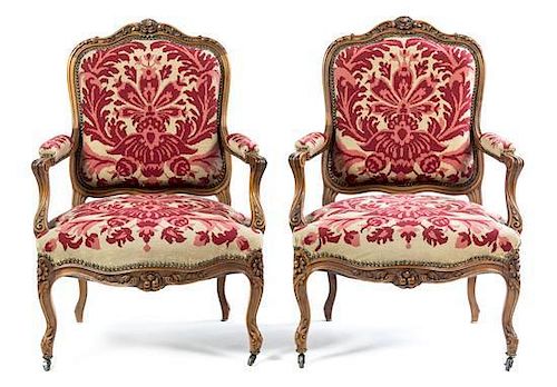 * A Louis XV Style Walnut Parlor Suite Width of settee 56 inches.