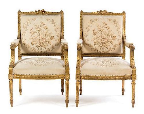 * A Pair of Louis XVI Style Giltwood Fauteuils Height 38 x width 24 1/2 x depth 19 inches.