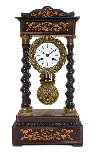 A Napoleon III Marquetry Decorated Ebonized Portico Clock Height 19 inches.