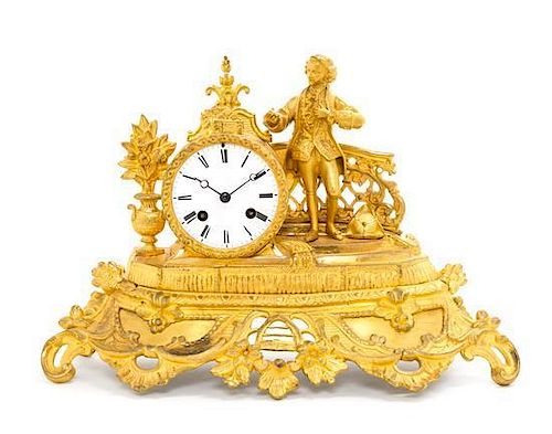 A French Gilt Metal Figural Mantel Clock Height 10 inches.