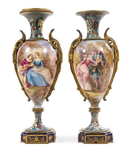A Pair of Gilt Bronze Mounted Sevres Porcelain and Champleve Urns Height 20 inches.