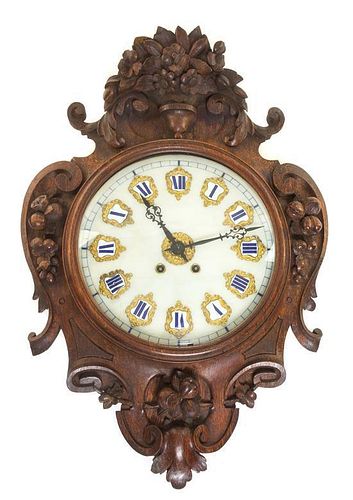 A French Oak Wall Clock Length 28 1/2 inches.