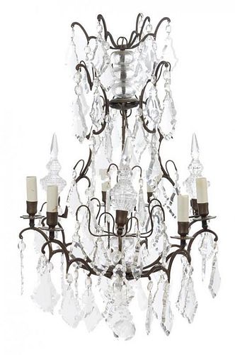 A French Brass and Glass Eight-Light Chandelier Height 41 inches.