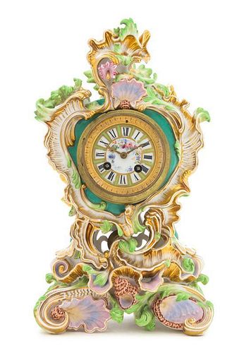 A Continental Porcelain Mantel Clock Height 15 x width 8 3/4 x depth 5 1/4 inches.