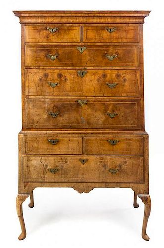 A George I Feather Banded Walnut Chest on Stand Height 69 x width 41 1/4 x depth 22 1/4 inches.