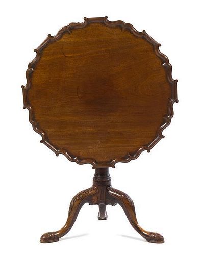A George III Mahogany Piecrust Tilt-Top Tea Table Height 27 x diameter of top 29 inches.