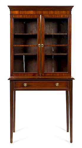 A Regency Mahogany Cabinet on Stand Height 64 1/2 x width 32 x depth 14 3/4 inches.