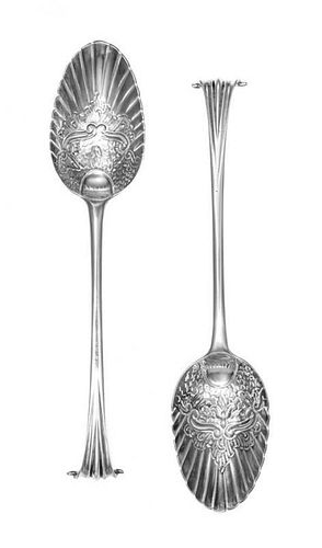 A Pair of George III Silver Berry Spoons, Hester Bateman, London, 1780, each having scroll handles with foliate and scale worked