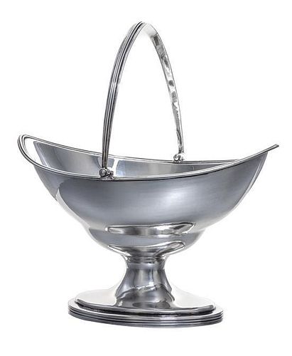 A George III Silver Sugar Basket, Hester Bateman, London, 1790, of oblong form with a reeded edge and a swing handle, raised on