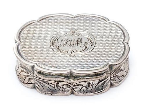 A Victorian Silver Vinaigrette, Edward Smith, Birmingham, 1857, of oval form with a scalloped rim, the sides worked with floral
