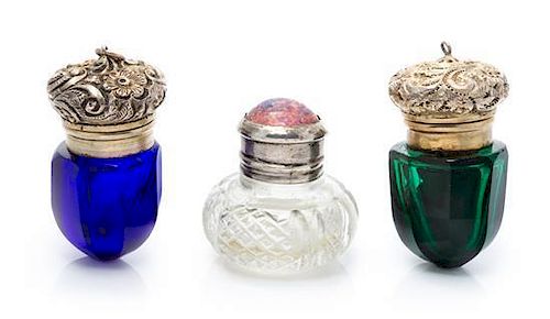 A Group of Three Silver Mounted Glass Scent Bottles, Apparently Unmarked, comprising two colored glass examples and one clear ex