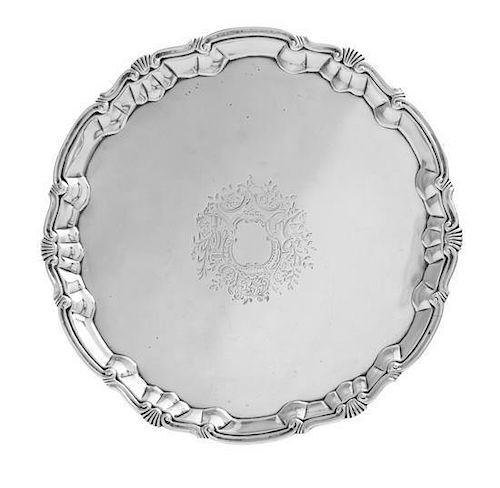 * A George II Silver Salver, William Peaston, London, 1749, having a shell border and chased with foliate design surrounding a v