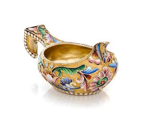 * A Russian Silver-Gilt and Enamel Kovsh, Mark of Mikhail Sokolov, Moscow, Late 19th Century, the body and handle decorated with