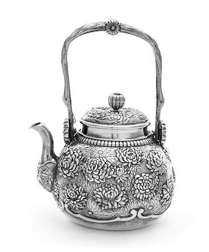 A Chinese Export Silver Teapot, , the body of globular form, finely chased with blooming chrysanthemums, having a curved side sp
