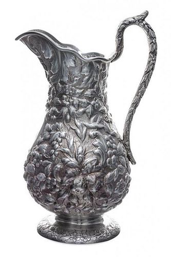 An American Silver Pitcher, Andrew Ellicott Warner, Baltimore, MD, 19th Century, having floral and foliate repousse decoration o