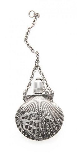 An American Silver Perfume Bottle, Gorham Mfg. Co., Providence, RI, in the form of a scallop shell suspended from a chain.
