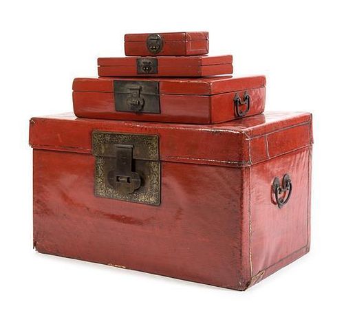 * A Set of Four Red Lacquer Hinged Boxes Largest: height 5 x width 19 1/2 x depth 14 1/2 inches.