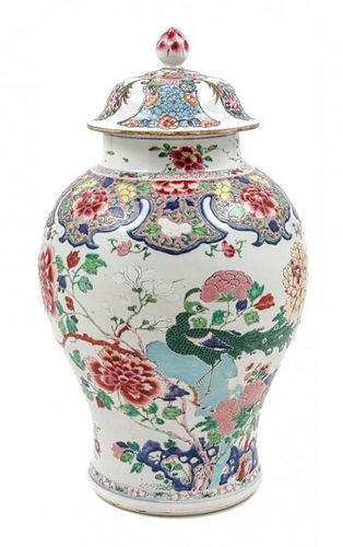 * A Chinese Export Famille Rose Porcelain Covered Jar Height 17 1/2 inches.