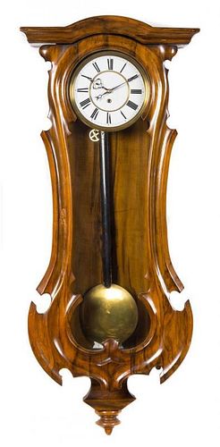 * An American Simulated Rosewood Wall Clock Length of case 38 1/2 inches.