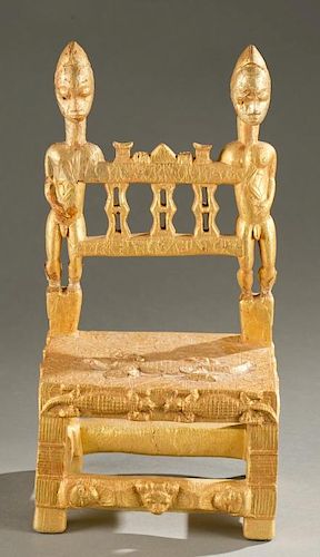 Baule gold leaf chair with male figures.