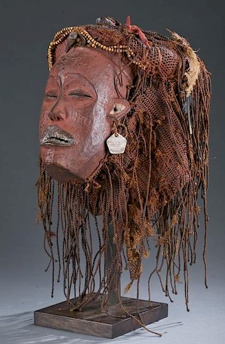 Female Pwo mask with elaborate fiber coiffure