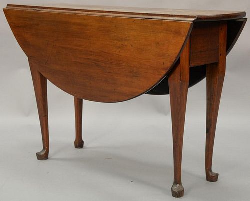Queen Anne cherry table with oval drop leaves, circa 1750. ht. 28in., lg. 43in., top open: 42 1/2" x 43"