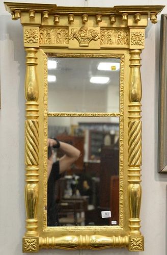 Federal gilt two part mirror with acorn drops, circa 1840 (slight chip on top and bottom frame edge of glass). ht. 38 1/2in., wd. 19...
