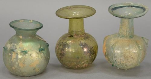 Three Roman Empire small glass flasks or sprinkler flasks, 3rd to 5th century A.D. ht. 3in. to 4in.