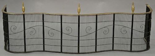 Federal brass and wire fire fender, serpentine form with three lemon top finials, circa 1840. ht. 18 1/4in., wd. 55in.