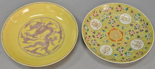 Two Oriental porcelain dishes including a dish having yellow ground with scrolling flowers and vines signed on bottom and a yellow g...