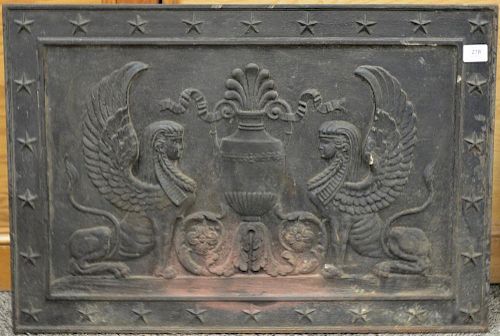William H. Jackson French Empire style iron fireback with winged sphinxes and urn center, marked on back: Wm. H. Jackson & Company 2...
