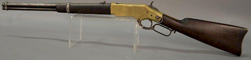 Winchester Henry 1866 Lever action rifle, fourth model manufactured around 1881, top of barrel is roll-stamped "Winchesters-Repeatin...