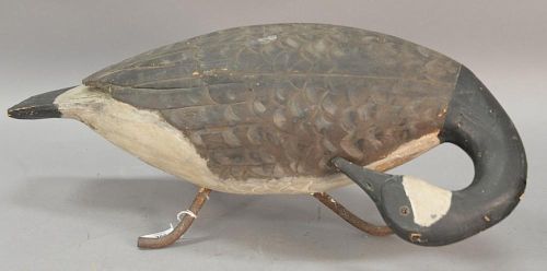 Large Prince Edward Island, Canada, carved wood goose decoy with glass eyes and painted with brown, black, and white plumage, set on...