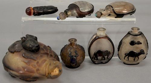 Seven overlay glass snuff bottles including two in the form of a turtle, one in the form of a beetle, three with pattern cut glass w...