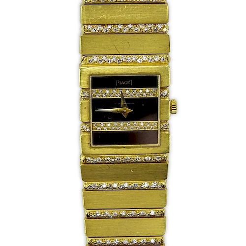 Lady's Vintage Piaget 21 Karat Yellow Gold and Round Brilliant Cut Diamond Polo Watch with Onyx Dial and Quartz Movement