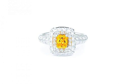 A Fancy Vivid Yellow-Orange Diamond Ring