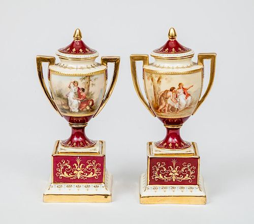 Pair of Vienna Small Porcelain Urns, Covers and Stands