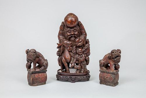 Chinese Carved Hardwood Figure of Shou-Lao and a Pair of Chinese Carved Wood Figures of Fu Dogs
