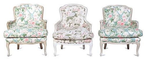 A Group of Three Louis XV Style White-Painted Bergeres Height of first 34 inches.