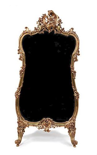 A Louis XV Style Giltwood Cheval Mirror Height 58 1/2 x width 34 1/2 inches.