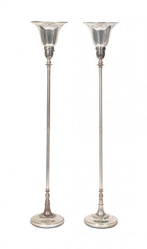 A Pair of Silver Torcheres Height 67 inches.