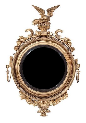 A Regency Giltwood Twin-Light Convex Mirror Height 45 x width 29 inches.