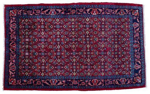An Oriental Wool Rug 5 feet 4 1/2 inches x 8 feet 10 inches.