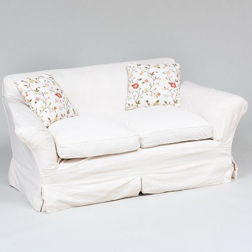 Pair of Slipcovered Two Seat Sofas with Two Needlework Pillows and a Club Chair
