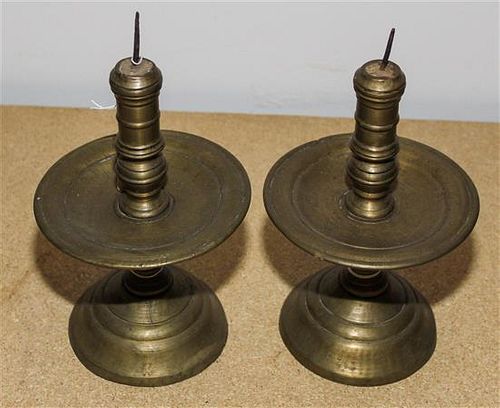 A Pair of Continental Brass Candlesticks Height 9 1/2 inches.